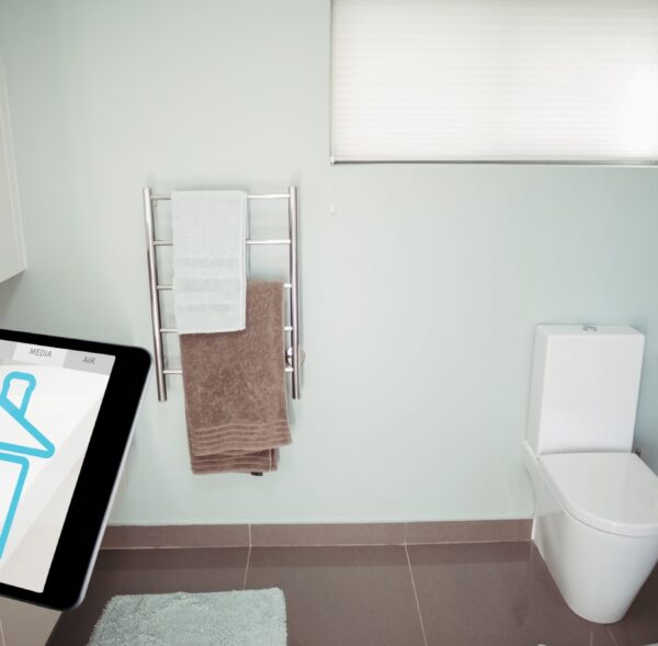 Digital composite of Hand using smart home application on digital tablet in washroom